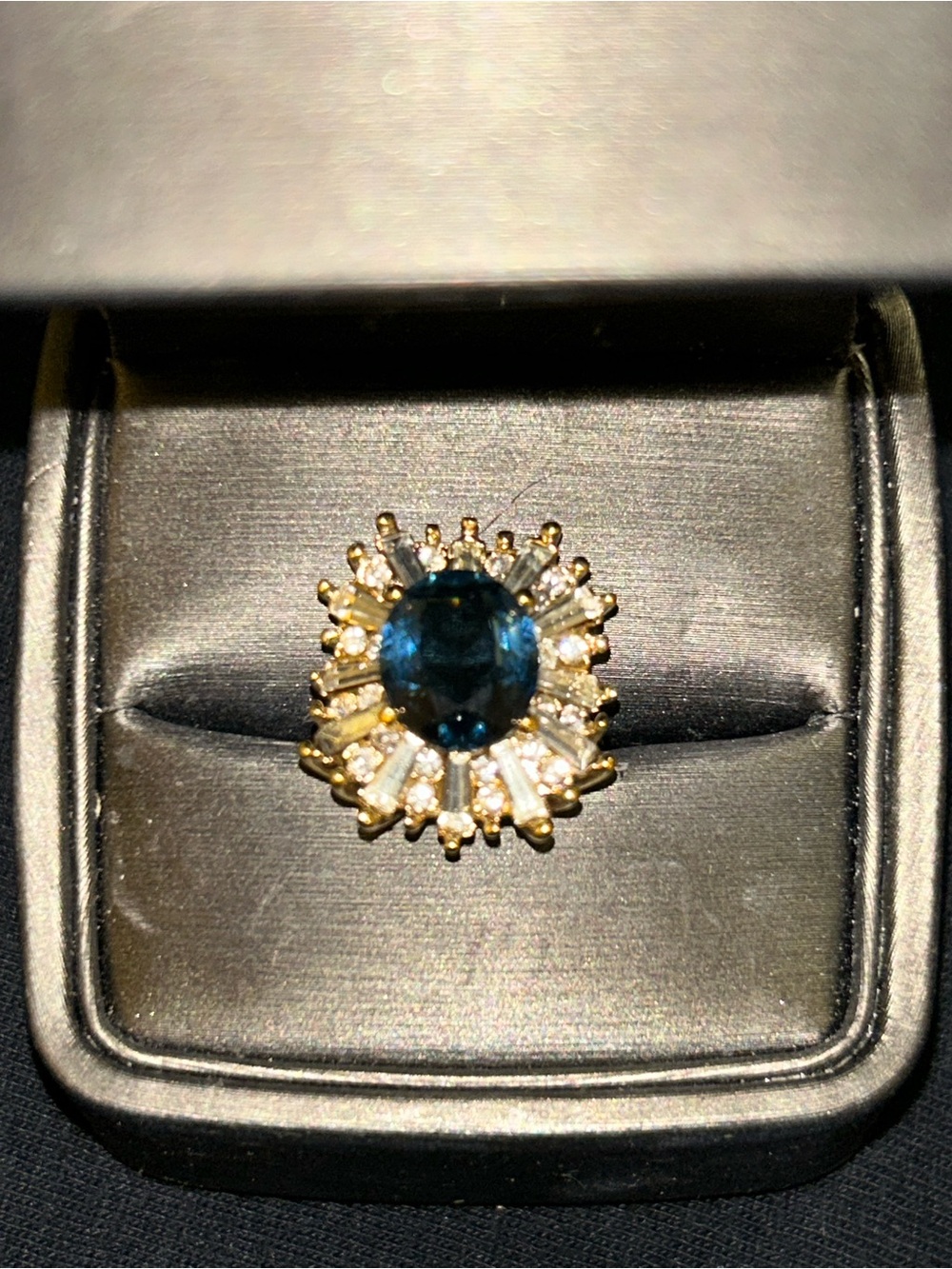 Gold Ring with Deep Blue Centerstone and Clear Baguette Halo